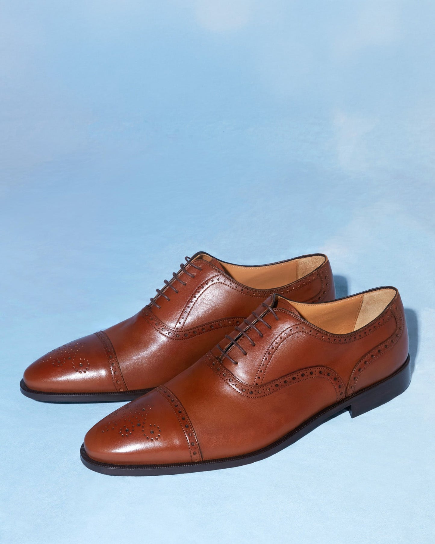 Leather Oxford-style shoes in a tan color