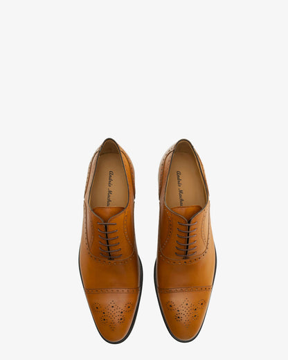 Leather Oxford-style shoes in a tan color