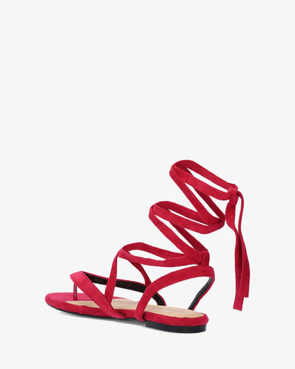 Sandalia plana en símil ante color fucsia