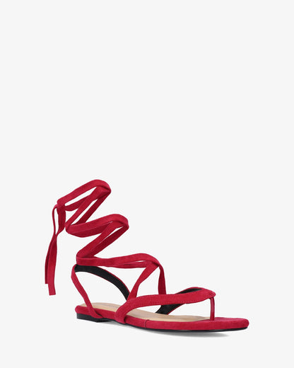 Sandalia plana en símil ante color fucsia