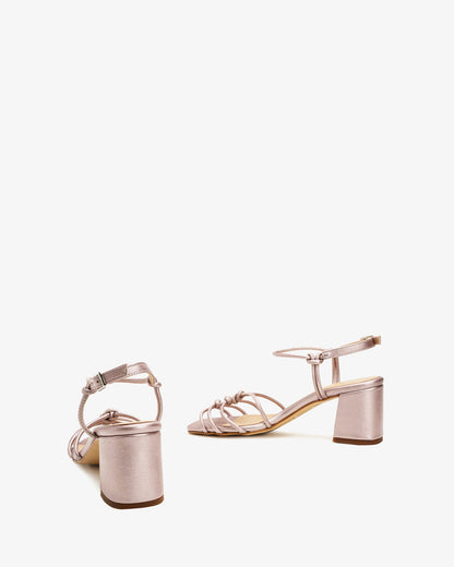 Metallic pink leather knotted sandals
