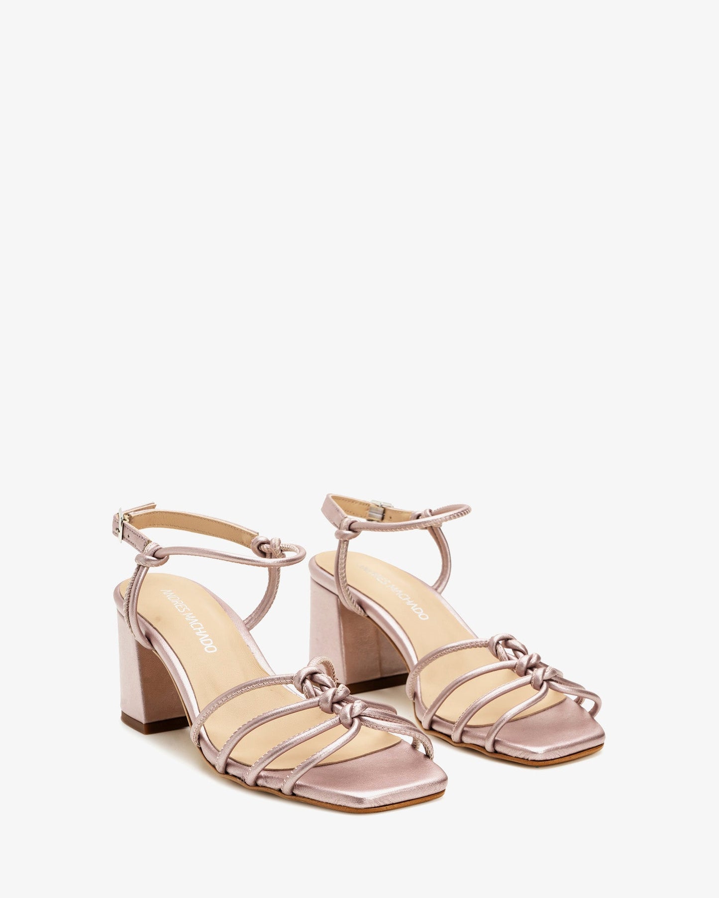 Metallic pink leather knotted sandals