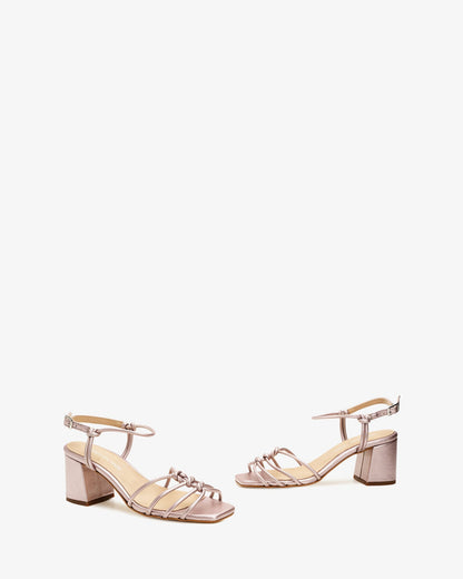 Metallic pink leather knotted sandals