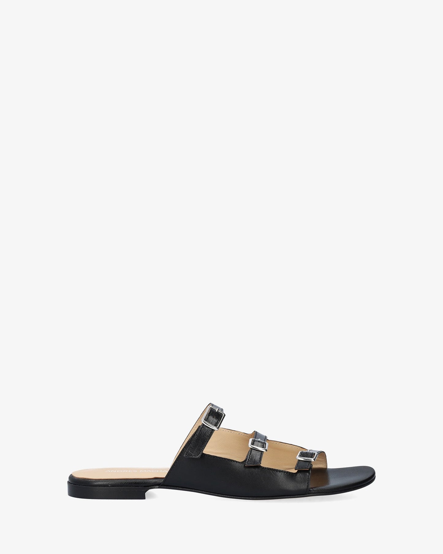 Flat sandal in black leather